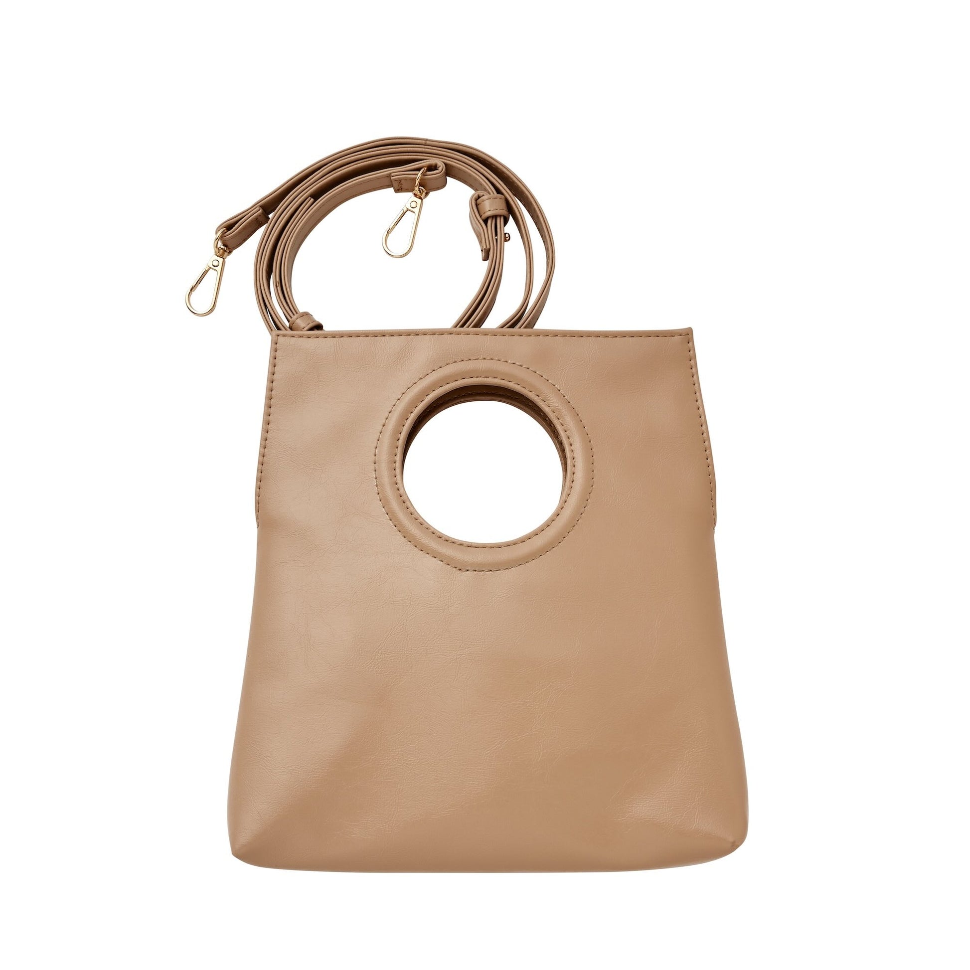 A taupe crossbody bag with a circular handle cutout, made from vegan leather, displayed against a plain background.