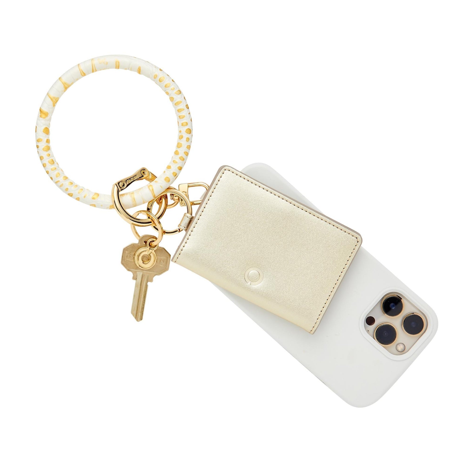 Stylish gold leather bifold keychain wallet accessory shown as a wallet wristlet.  The id case is attached to a bracelet keyring with a phone case.