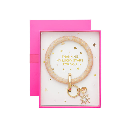 Oventure Big O Silicone Key Ring in Gold Confetti with Star Charm attached. Comes in a hot pink gift box stating Thanking my Lucky Stars for you